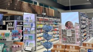 Hy-Vee Beauty Section with retail media screens
