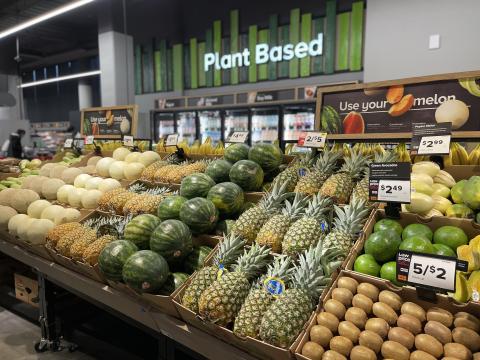 a store filled with lots of fresh fruit and vegetables on display